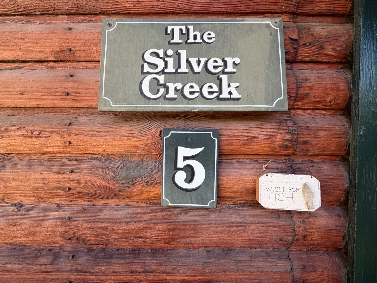 Outside — The Silver Creek nameplate — and the little sign beside it: Wish for Fish.