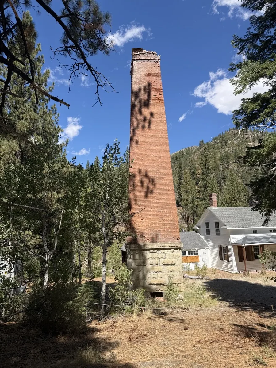The 1862 brick smelter chimney standing alone at Silver Mountain City —.