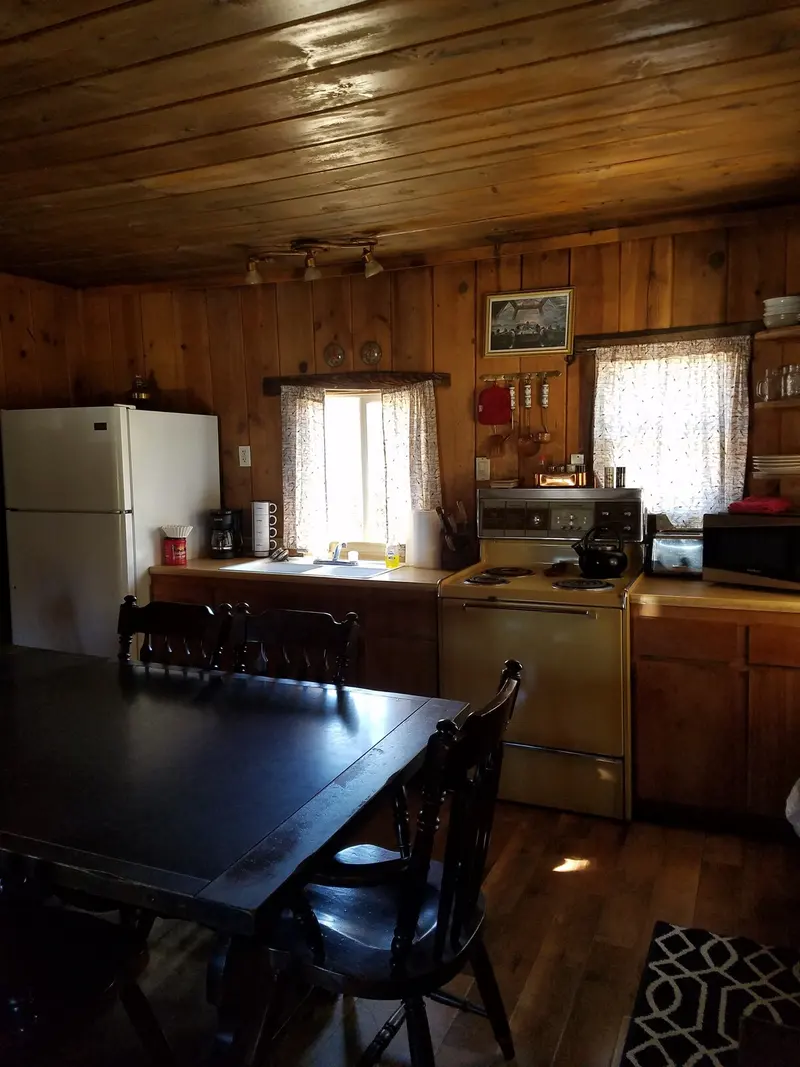 The dining room — Table and kitchen together — the room where a whole party eats.