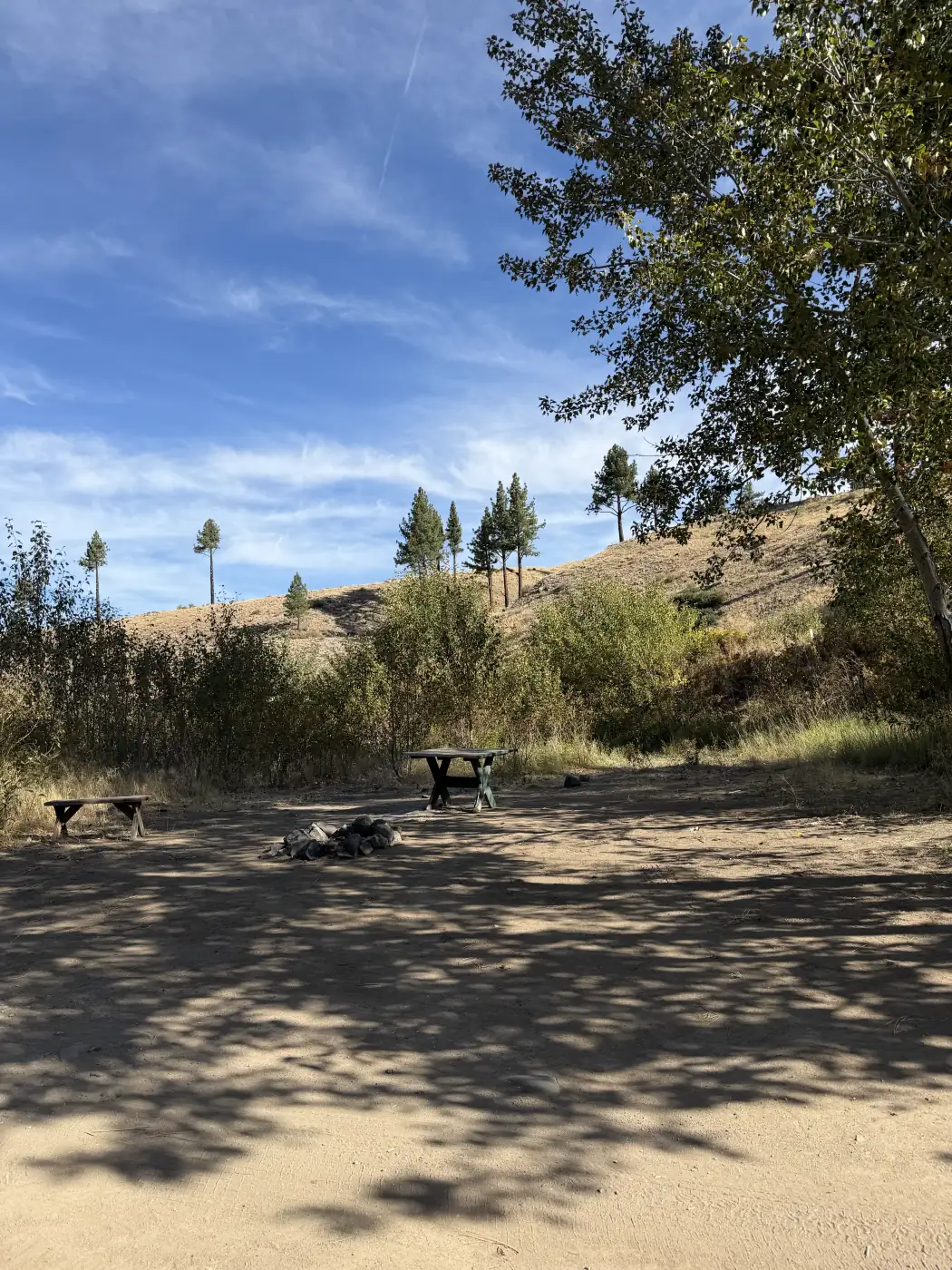 Riverside site 8 — the table with the sage and the hillside behind — the owner's photograph, September 2026.