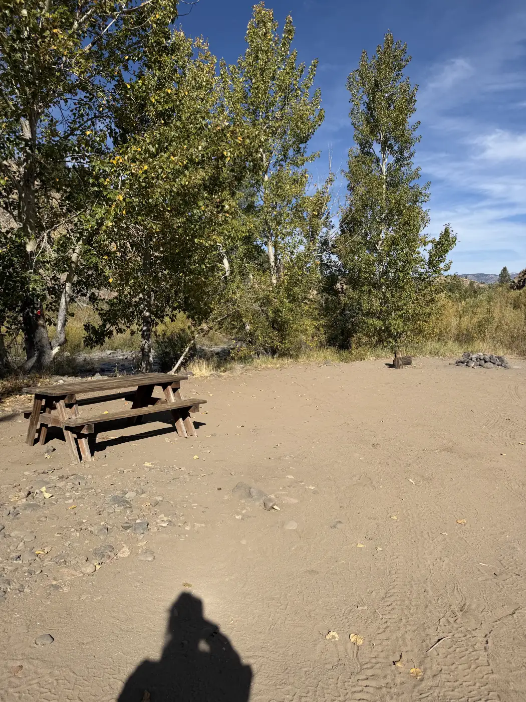 Riverside site 9 — the table on the gravel bar under the cottonwoods — the owner's photograph, September 2026.