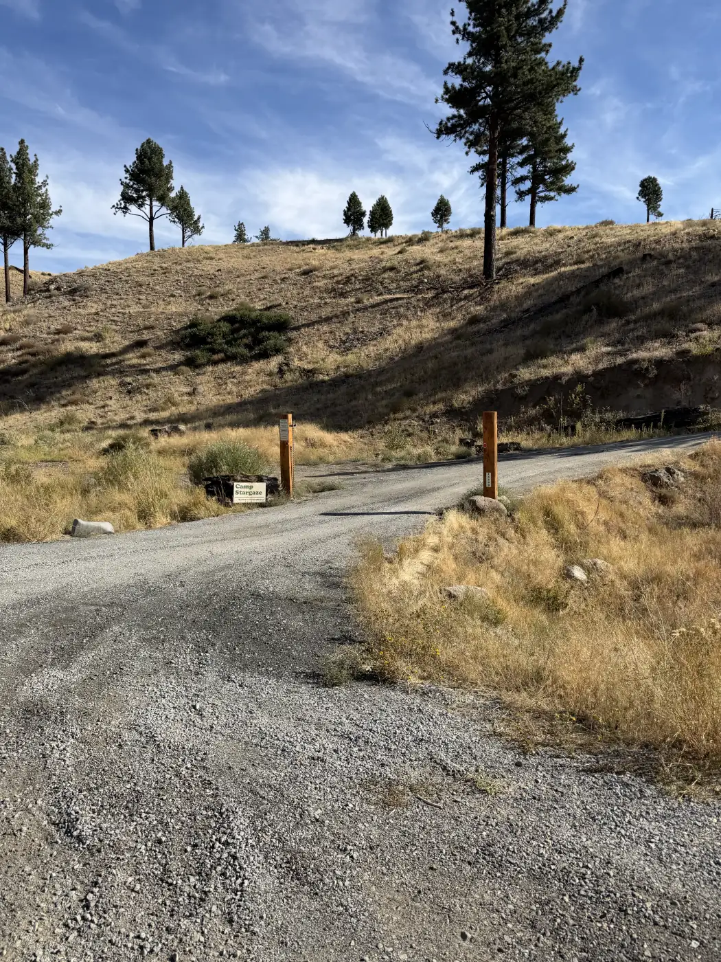 The drive in from Highway 89 to the sites — the entrance posts and the sign — the owner's photograph, September 2026.
