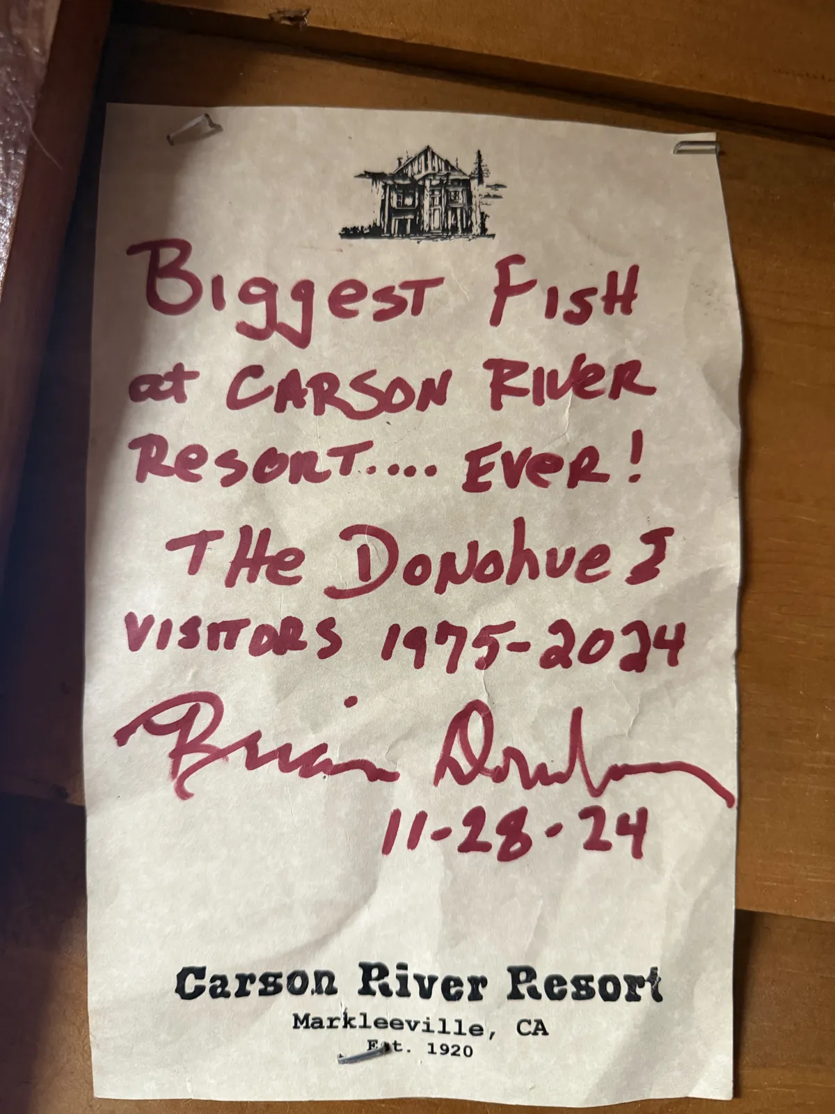 On resort stationery, in marker: "Biggest fish at Carson River Resort… EVER!" — the Donohues, visitors 1975–2024.