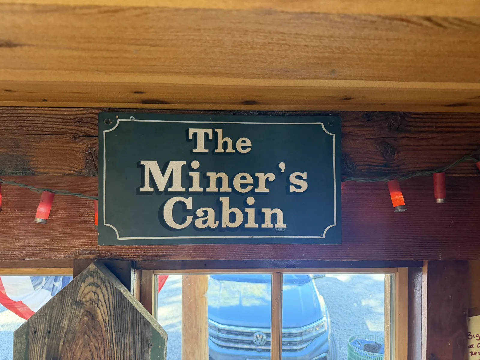The Miner's Cabin sign over the window.